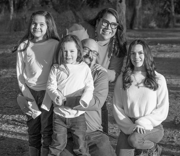 black and white image of Marisa Page with her family